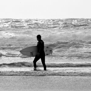 Surfer at breaking waves near Newquay